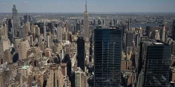 Buildings in the Manhattan skyline in New York, US, on Saturday, May 10, 2025. New York City officials cut their forecast for the number of international tourists this year by 17%, saying President Donald Trumps tariffs and hard-line policies on immigration are deterring visitors. Photographer: Yuki Iwamura/Bloomberg via Getty Images