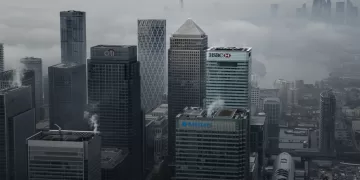 LONDON - Nov. 5, 2020: Fog shrouds the Canary Wharf business district including global financial institutions Citigroup Inc., State Street Corp., Barclays Plc, HSBC Holdings Plc and the commercial office block No. 1 Canada Square.